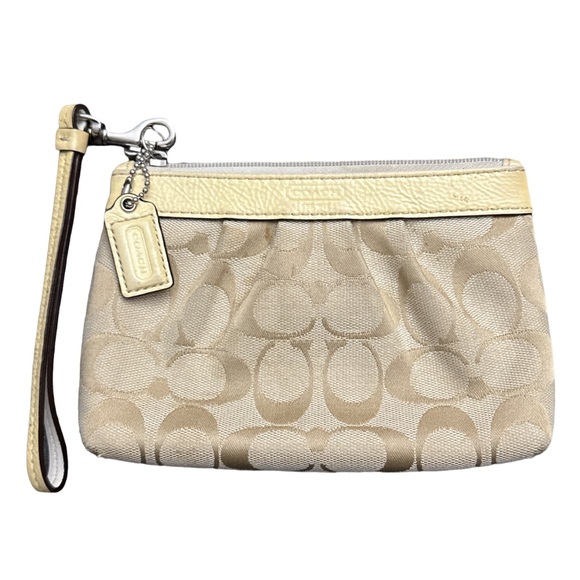 Coach Handbags - COACH Y2K women's yellow leather signature beige monogram wristlet with strap.